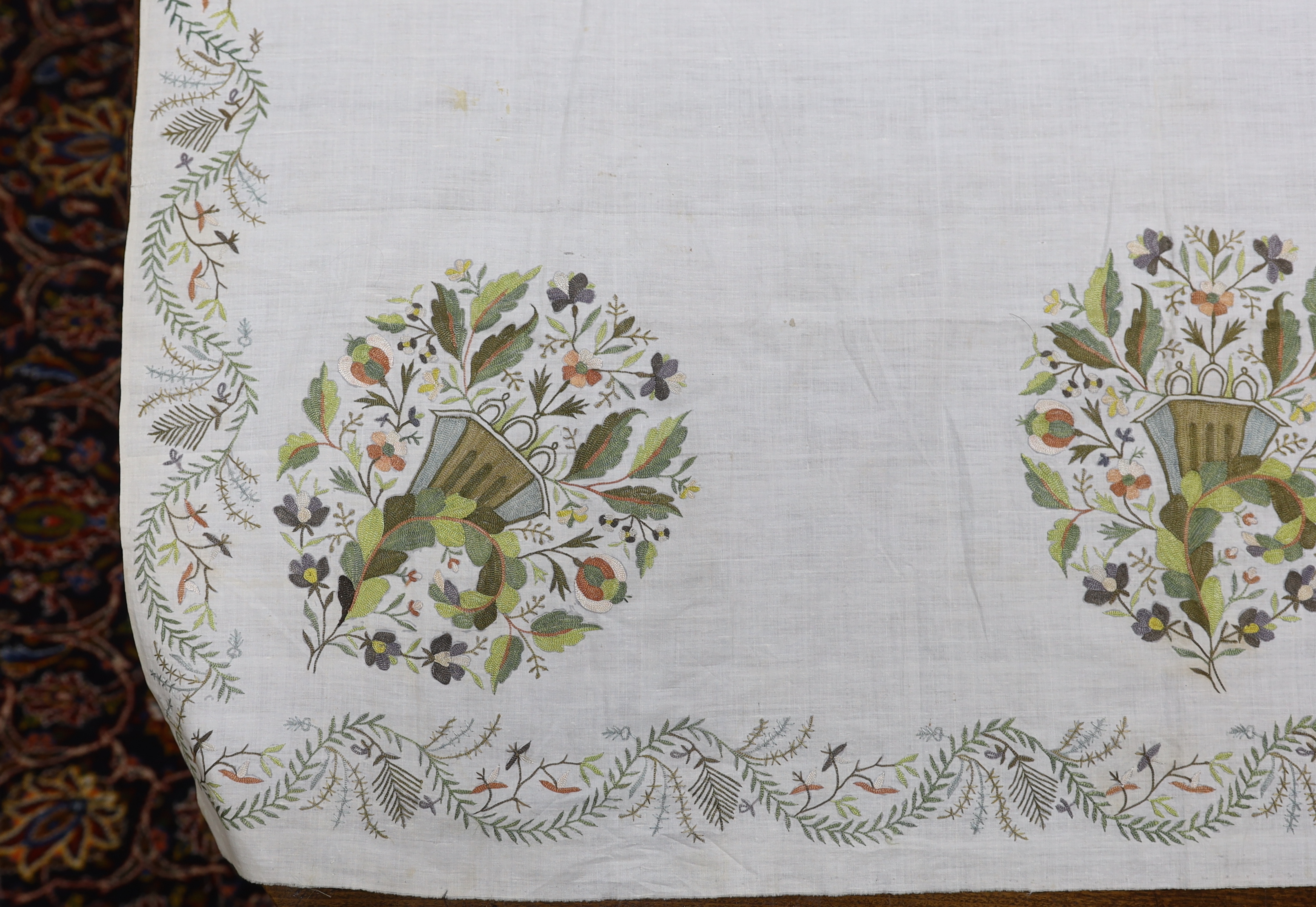 A late 18th-19th century fine linen chain stitched floral embroidered panel, possibly Kashmiri, using traditional design elements and embroidery similar from earlier embroideries of this kind worked on narrower looms, 22